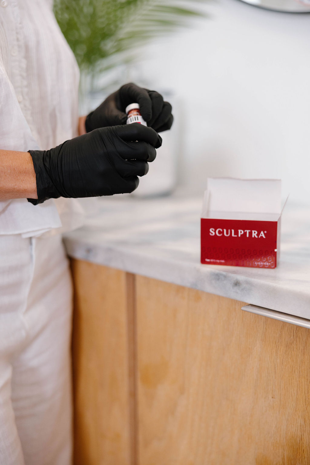 A licensed injector in a professional clinic setting